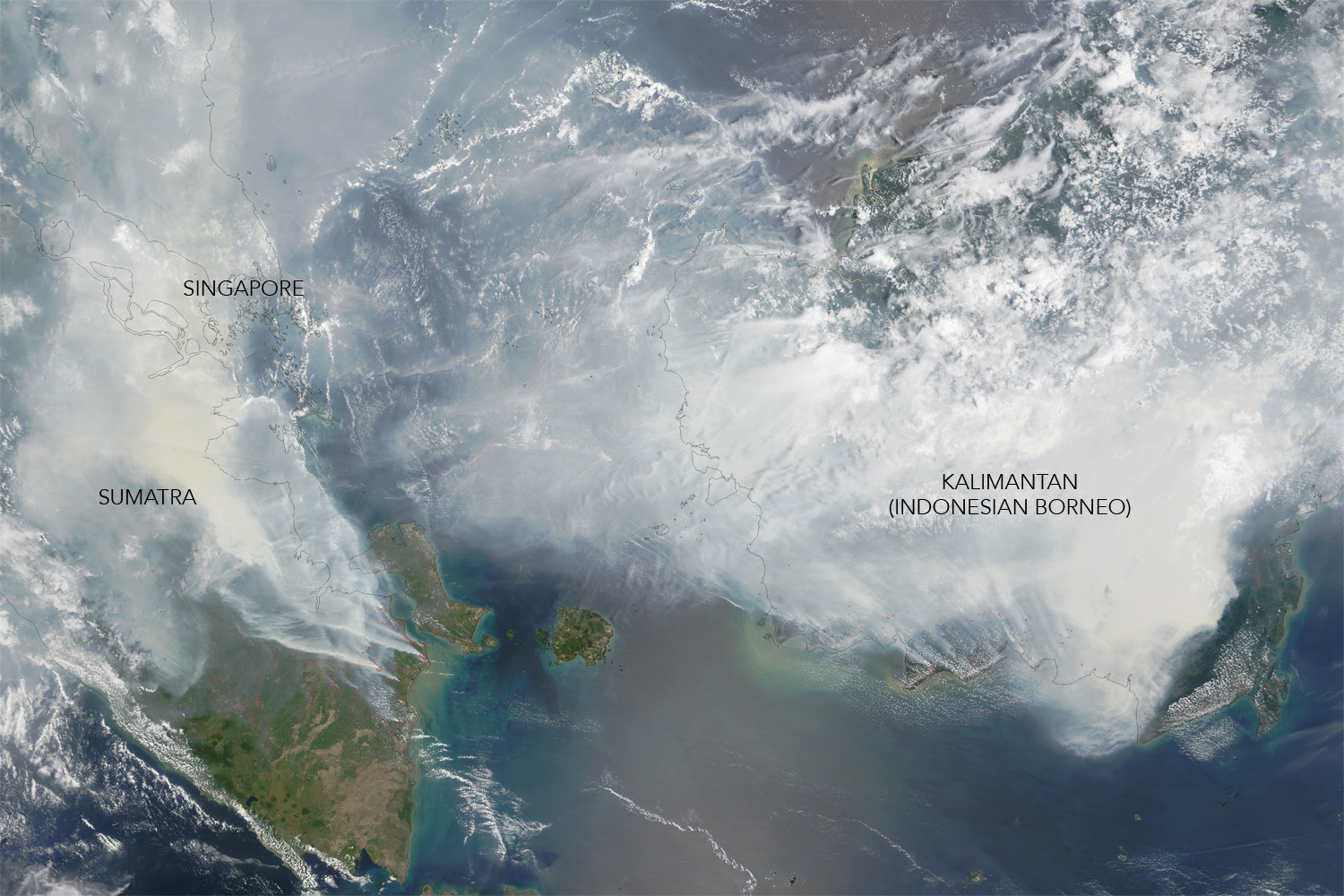 Image taken September 24 from the Moderate Resolution Imaging Spectroradiometer (MODIS) on NASA’s Terra satellite shows the "haze" as its peak. Red outlines indicate hot spots where the sensor detected unusually warm surface temperatures associated with fires. Thick gray smoke hovers over both islands and has triggered air quality alerts and health warnings in Indonesia and neighboring countries. Visibility has plummeted. NASA image by Adam Voiland (NASA Earth Observatory) and Jeff Schmaltz (LANCE MODIS Rapid Response). Caption by Adam Voiland.