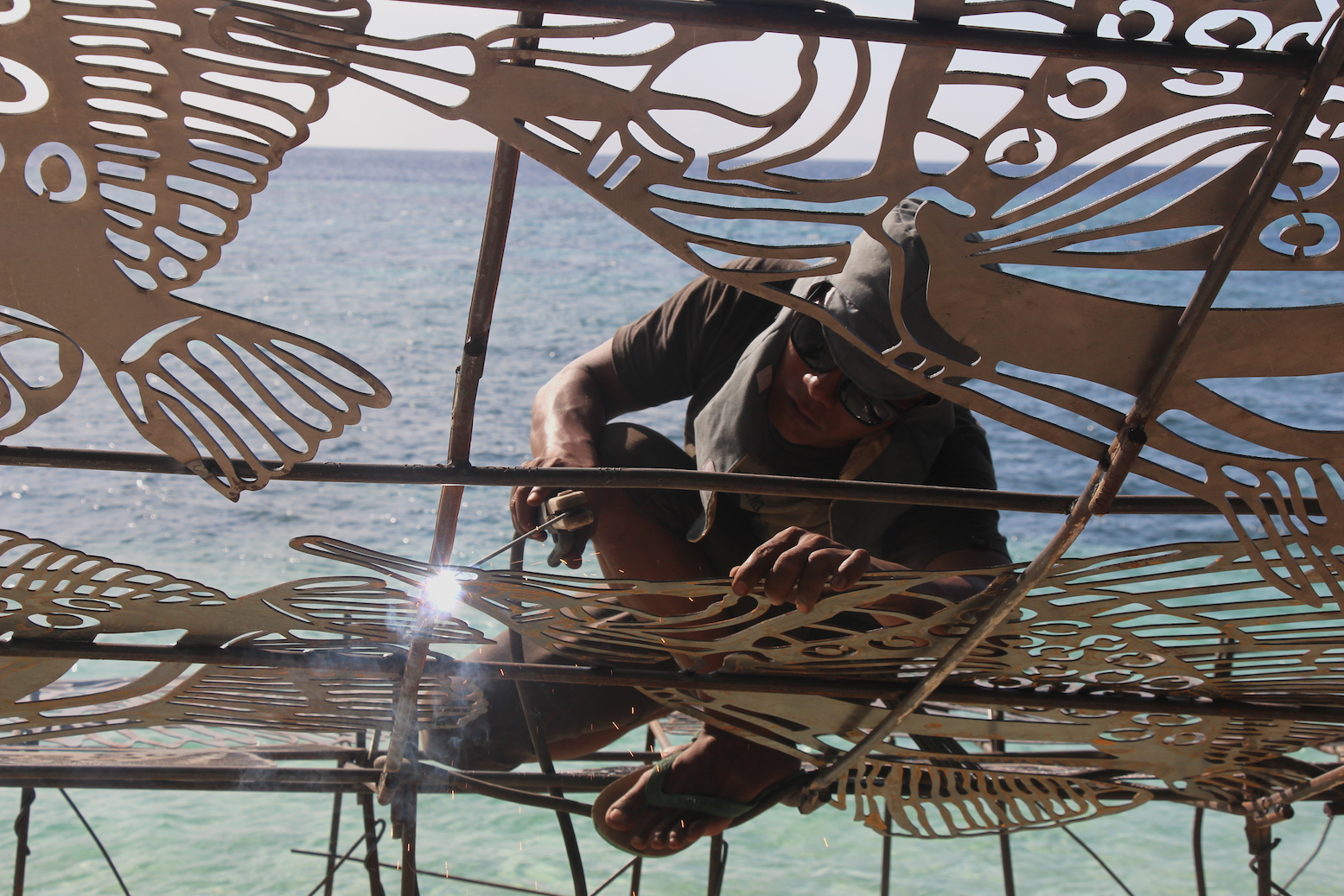 A worker welds together the ARTificial reef in Wakatobi ahead of Coral Day in Southeast Sulawesi. Photo by Melati Kaye