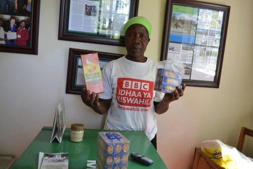 Mary Lumiti displays some of the finished products manufactured from forest herbs. Photo by Isaiah Esipisu.