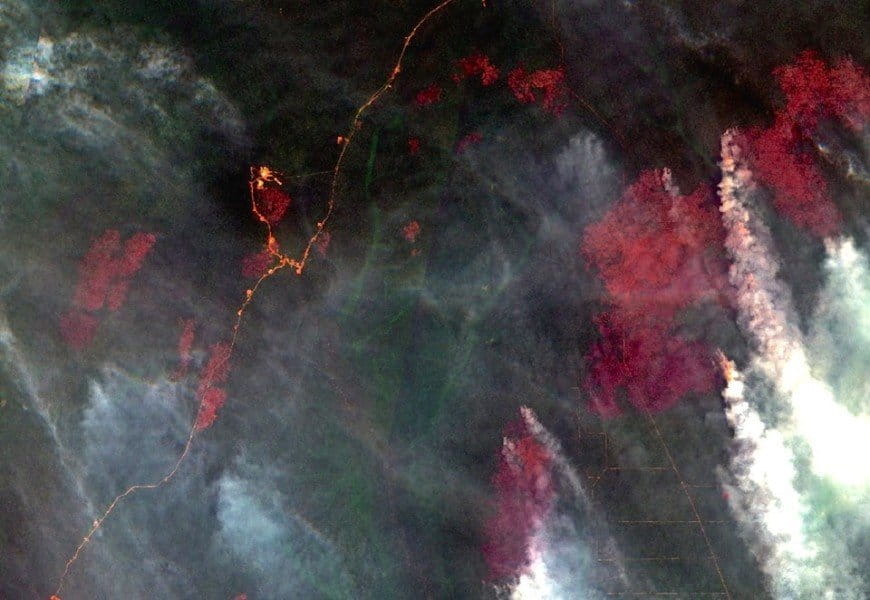 A satellite image captured February 4 shows burned areas and smoke billowing from active fires. Image source: COPERNICUS DATA (2016) / ESA.