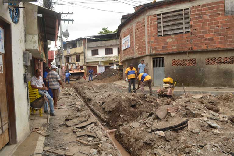 Public Works in Asa Branca: Workers install sewer and water pipes in the Asa Branca favela of Rio de Janeiro. Such work is often long delayed by lack of money or bureaucratic red tape. Photo by Catalytic Communities