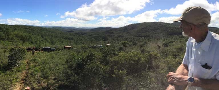 Dr. Silva Taboada, curator emeritus at the Cuban National Museum of Natural History, overlooks Humboldt Park National Park as the AMNH/MNHN expedition convoy departs. Maps don’t convey the difficulty of traversing the terrain. Photo courtesy of ©AMNH/A. Porzecanski