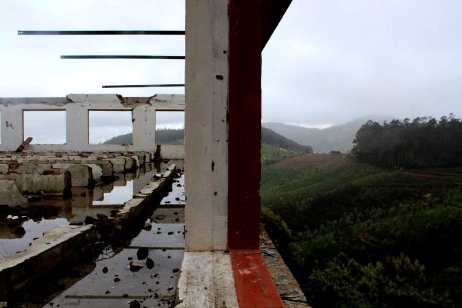 A demolished tea factory at Cinchona overlooks abandoned tea estates that are set to soon become 50 acres of reforested native shola forest and grasslands. Photo by Sibi Arasu 