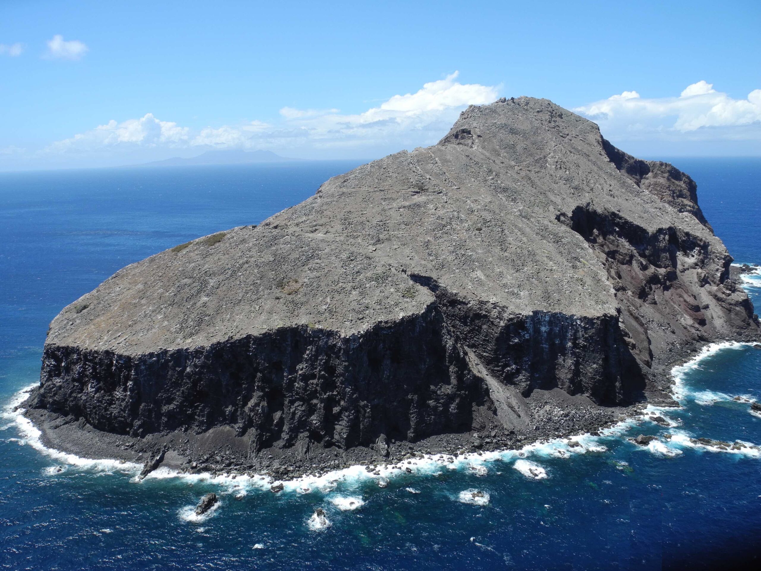 Redonda from the air. The island, once forested, now looks like a lunar landscape. Photo by Jenny Daltry/Fauna & Flora International.