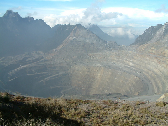 The giant Grasberg open-pit copper and gold mine in Indonesian Papua on the island of New Guinea. U.S.-based mining giant Freeport, which operates the mine, was also granted an exemption from the 1999 Forestry Law. Photo by Alfindra Primaldhi/Wikimedia Commons 