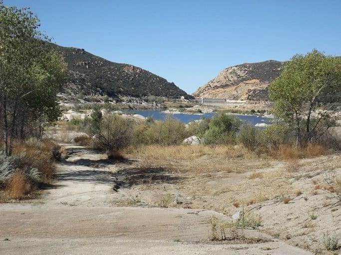 Morena Reservoir in San Diego County, California, at less than 3 percent capacity. This reservoir provides tap water to San Diego. US drought has escalated dramatically due to climate change in blue states and red states. Climate models forecast a deepening of the crisis — putting US drinking water, agriculture, hydropower and the national economy at grave risk — unless carbon emissions are cut drastically. Photo by Ruff tuff cream puff made available under the Creative Commons CC0 1.0 Universal Public Domain Dedication