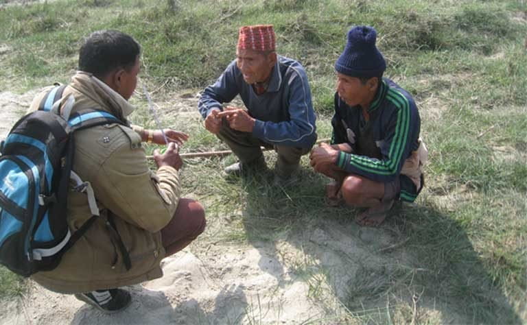 Training community forestry guards to find tiger tracks. Local women, with their many home duties, rarely have time to be involved in such projects, so they lack knowledge of conservation initiatives and their value to the community. Photo courtesy of Teri Allendorf