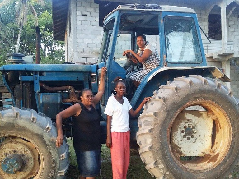 Kwakwani loggers Jennifer Edwards in tractor, and (l-r) Devina Palls and Lorraine Franco. Photo by Akola Thompson for Mongabay