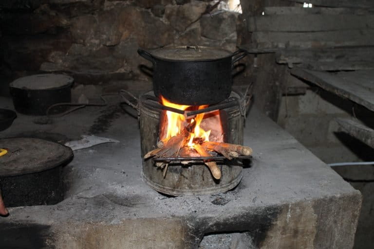 A tea kettle boils atop a TK90 stove provided by FFI Vietnam. Photo by Michael Tatarski for Mongabay