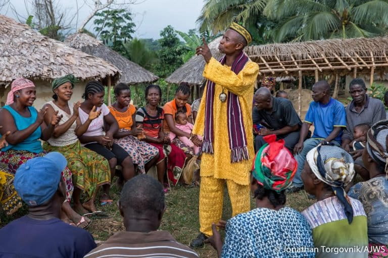 Members of the Jogbjan Clan gather for a community meeting in Grand Bassa, Liberia. The clan has been documenting issues using the TIMBY platform. 