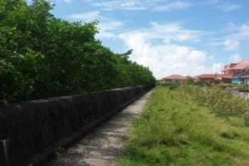 House construction alongside the seawall in Felicity, Guyana. Photo by Carinya Sharples for Mongabay.