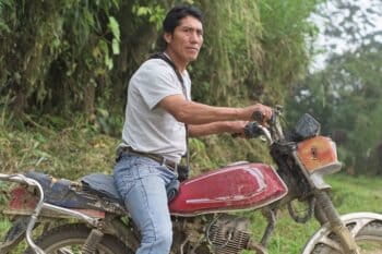  Basantes readies his motorcycle as he prepares to lead a group of tourists to one of the Mashpi Amagusa Reserve’s birdwatching areas. Photo by Johnny Magdaleno/Mongabay