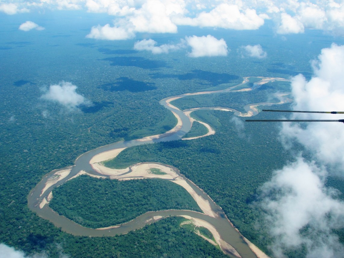 The rainforest along a meandering river in southeastern Peru. Clouds block the "view" that satellites' optical sensors have of the Earth below. 