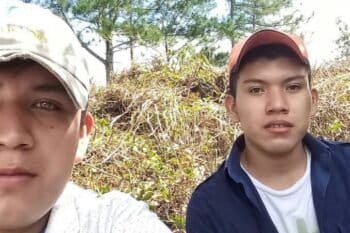 Héctor Choc Cuz, right, poses with his brother. Choc Cuz, 18, was beaten to death on the edge of El Estor and died on March 31, 2018. Image courtesy of Angélica Choc.