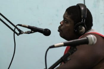 Cesar Benedict goes on air at Faluma Bimetu community radio station in Triunfo de la Cruz. Image by Christopher Clark for Mongabay.