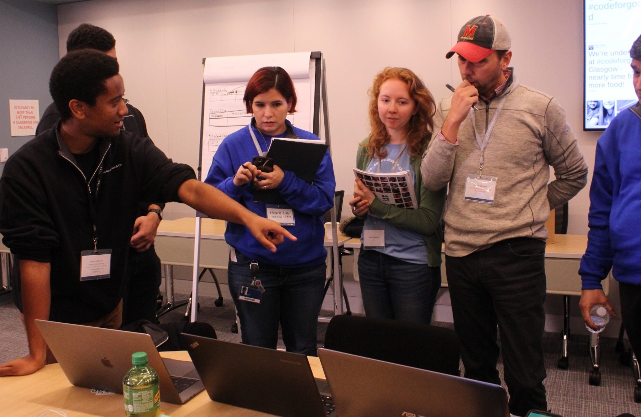 Nahum Getachew of Columbia University pitches his team’s product to RARE staff. His team developed a mobile app that pits university students against each other to earn points for building sustainable habits. 