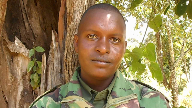 Lazarus Lentula, a 27-year-old leader of the Yiaku forest guards, who patrol and monitor Mukogodo for illegal activity. Image by Shadrack Kavilu for Mongabay.