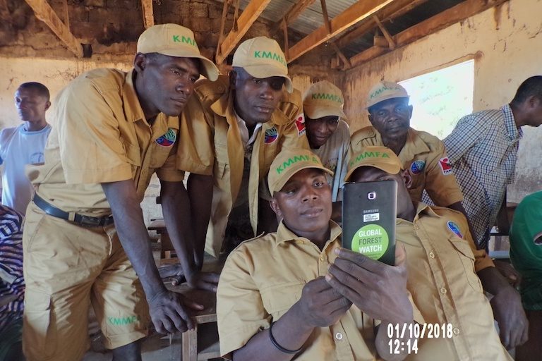 Members of a village patrol, equipped with smartphones to log incidents of deforestation. Image courtesy of Durrell Wildlife Conservation Trust.