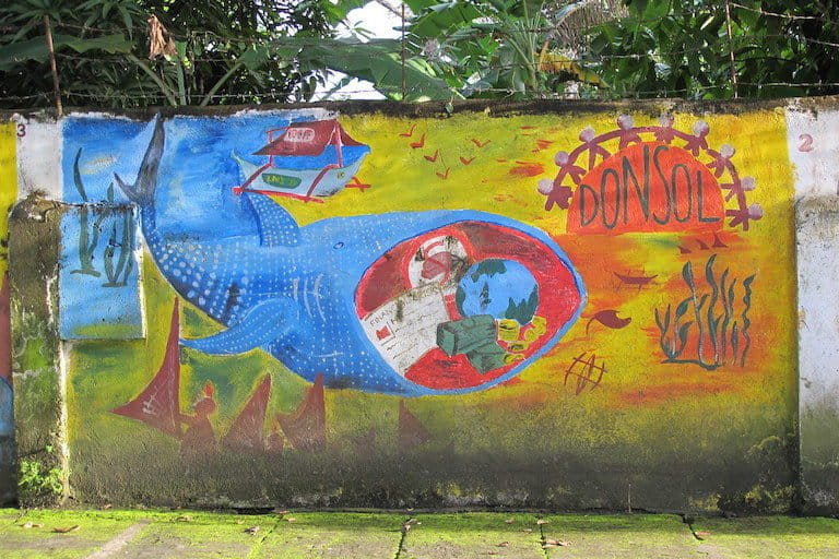 A mural in Donsol, the Philippines, shows some of the benefits of whale shark tourism. Photo taken in 2012. Image by 533338 via Flickr (CC BY-NC 2.0). 