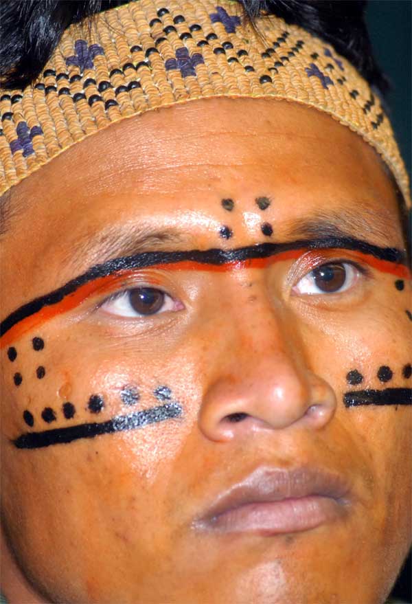 Traditional Yanomami face painting. The Yanomami were decimated by a previous mining invasion in the late 1980s when many died. Elders fear that this new invasion will have similar devastating impacts. Image by Fabio Rodrigues Pozzebom / Agência Brasil.