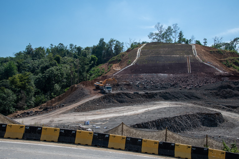 A hillside cleared of trees next to the Pan Borneo Highway. Image by John C. Cannon/Mongabay.