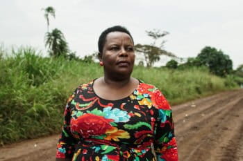 Beatrice Rukanyana looks out over a sugar plantation near Bugoma Forest. Photo: Thomas Lewton