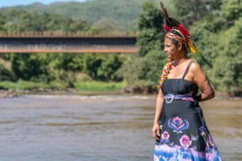 Shaman Angohó Ha-ha-hãe, one of the leaders of Naô Xohã indigenous village, poses for a photo close to the Paraopeba River. The Naô Xohã community is requesting to be temporarily relocated by Vale due to the river pollution. Image by Luiz Guilherme Fernandes for Mongabay