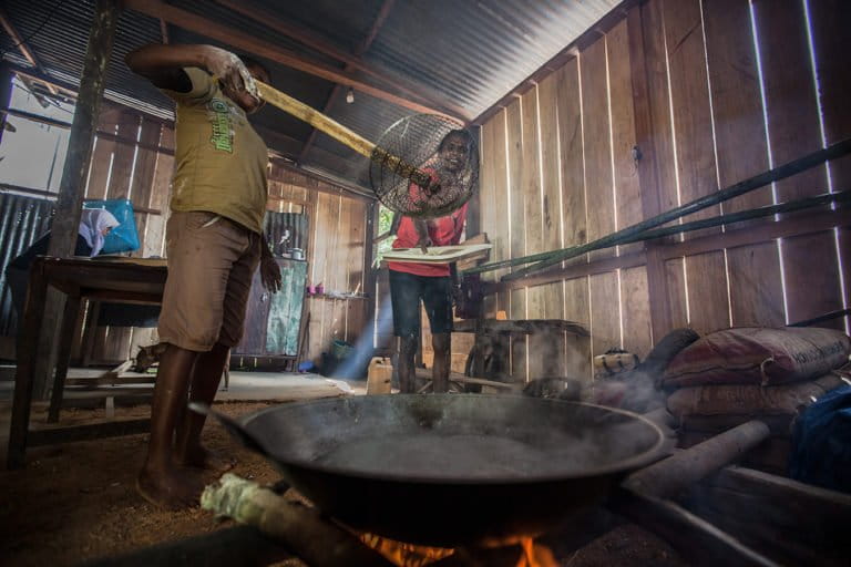 A Papuan woman making sago noodles at her house in Sira village, Teminabuan, South Sorong, West Papua. Sago is a starch extracted from the pith of various tropical palm stems. Credit line: © Jurnasyanto Sukarno / Greenpeace