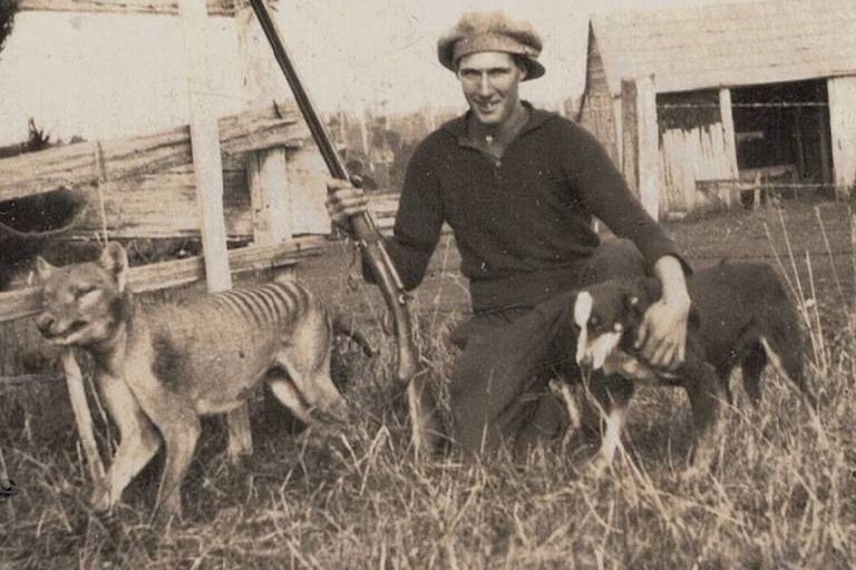 Wilfred Batty of Mawbanna, Tasmania, with the last thylacine known to have been shot in the wild. He claimed to have shot it in May, 1930, after discovering it in his hen house. Image in the public domain.