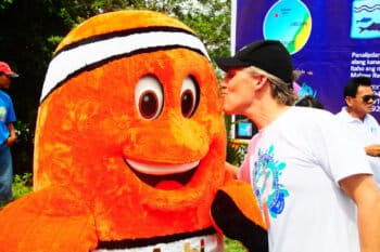 Brett Jenks visits with Mabi, the clown fish mascot of a community Pride campaign in the Philippines in 2011. Photo credit: Rare