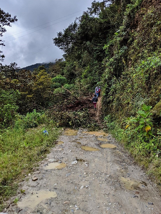 A small landslide blocks a road north of San Juanito in the Eastern Andes. Landslides have a large economic toll in Colombia, blocking roads and destroying infrastructure. Research shows that it can be 16 times more cost-effective to pay for forest protection and restoration for landslide mitigation near key infrastructure than to pay the price of fixing ruined roads, pipelines and powerlines. 