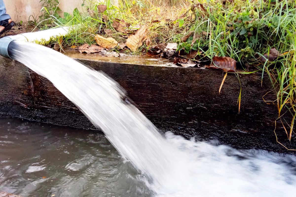 An artesian well that continuously discharges water 24 hours a day because it lacks a valve.