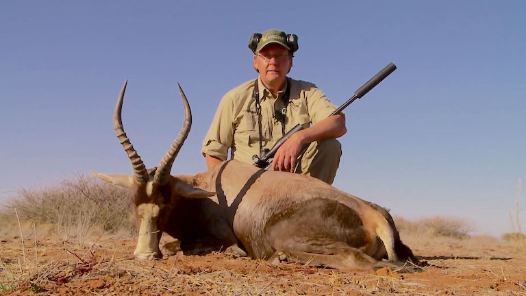 Hunter with a blesbok in Namibia. Image by Mikael Tham via Wikimedia Commons.