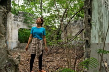 Premsinee in the ruin of her old school.
