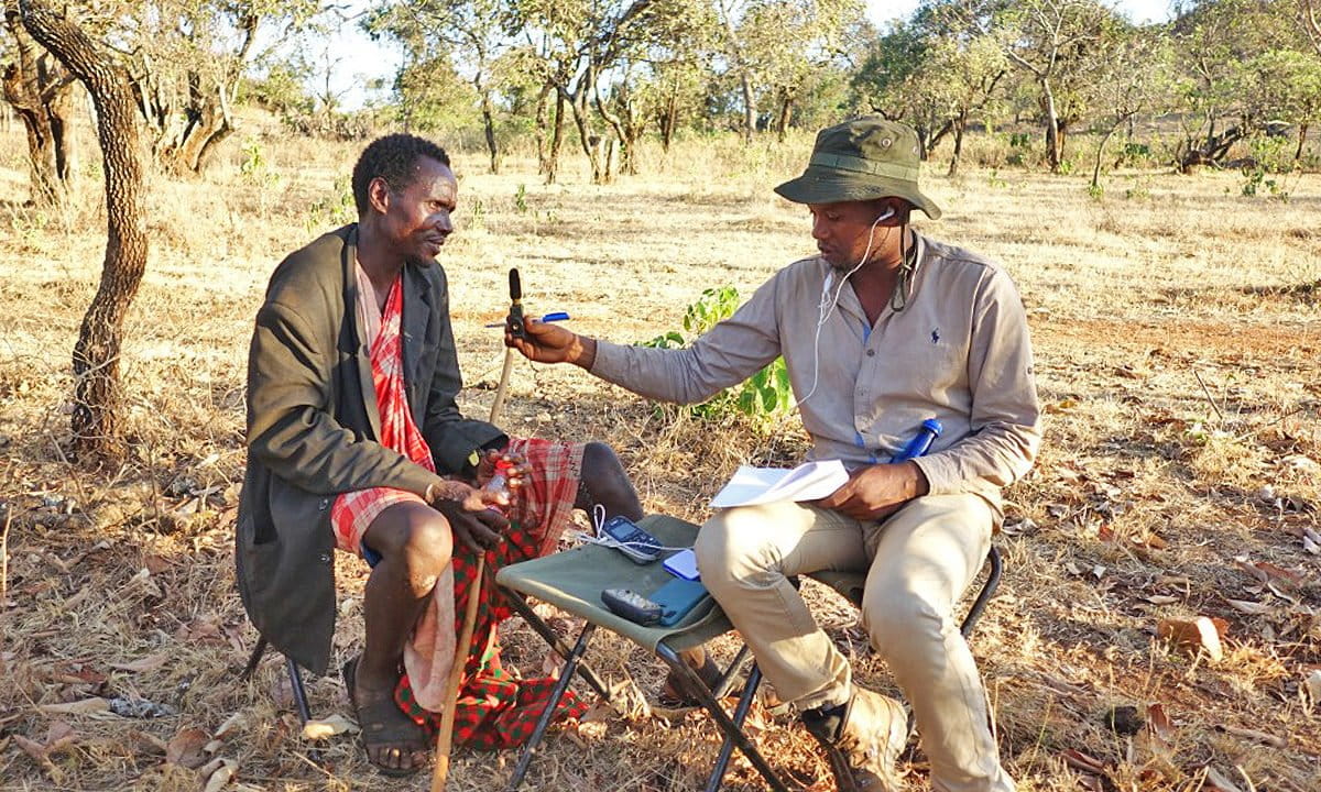 Eliupendo Laltaika interviewing a member of the Sonjo community.