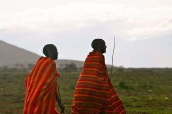 Maasai walking in rain in Kenya. Image courtesy of David via Flickr (CC BY-NC-ND 2.0).