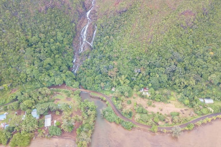 A waterfall near the mine of Goro running through the Gondwana-era forest towards New Caledonia's UNESCO recognized coral reef lagoons. Image courtesy of Lachie Carracher.