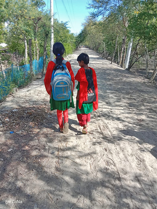 Two girls walk in Satkhira, Bangladesh