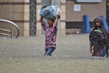 People wading through water.