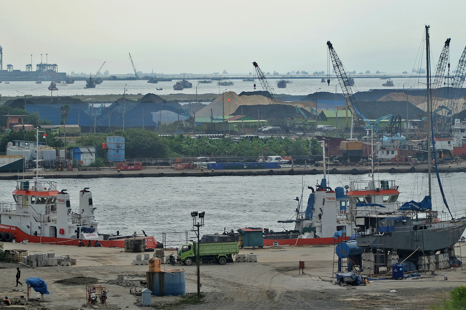 The load and unload coal of PT Karya Citra Nusantara as seen from the rooftop of Rusunawa Marunda