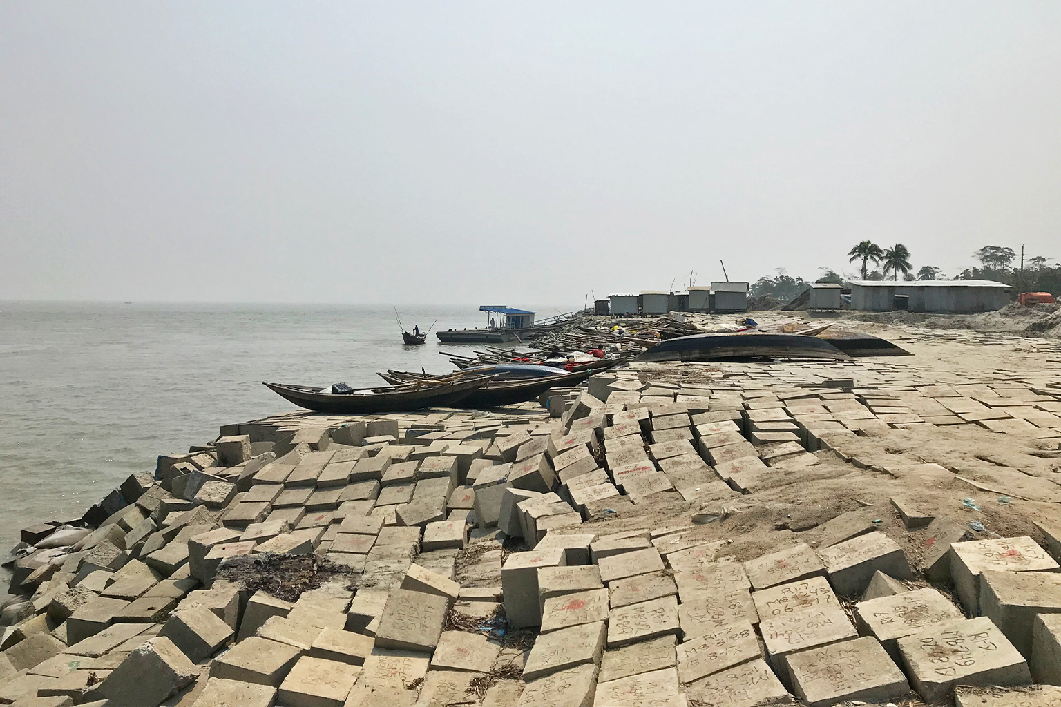 Concrete blocks arranged to protect a river bank.