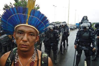 An Apiaká Indigenous leader in front of police blockade