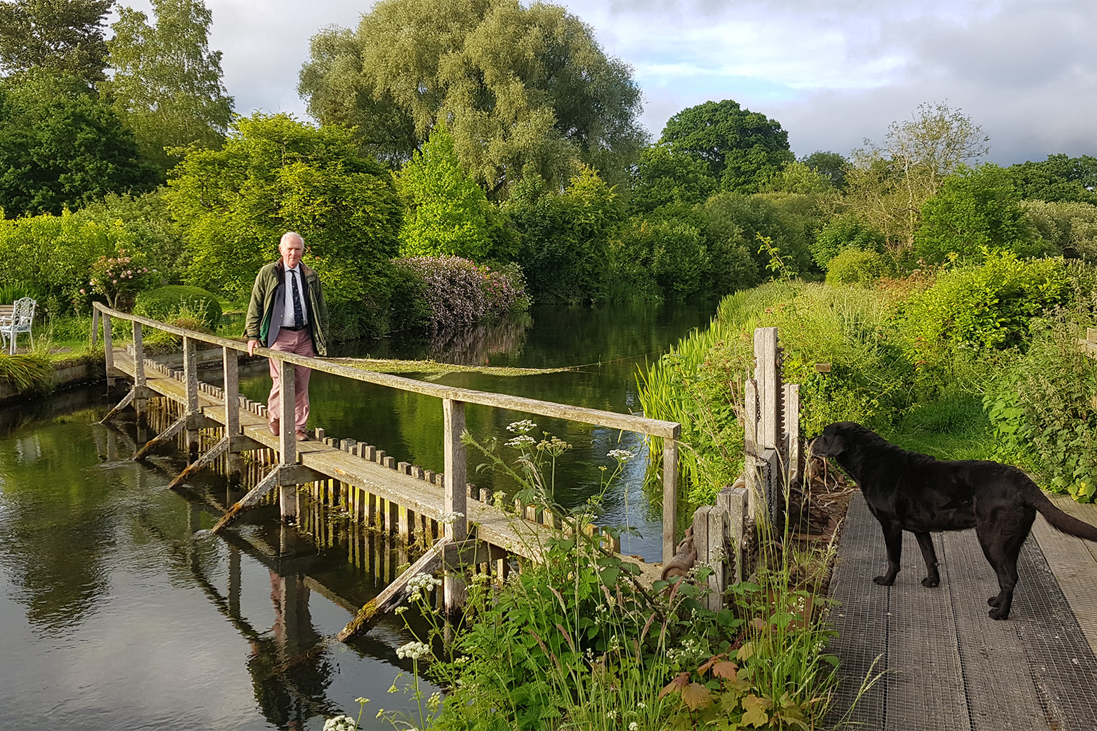 Environmentalist Roger Harrison crossing a bridge