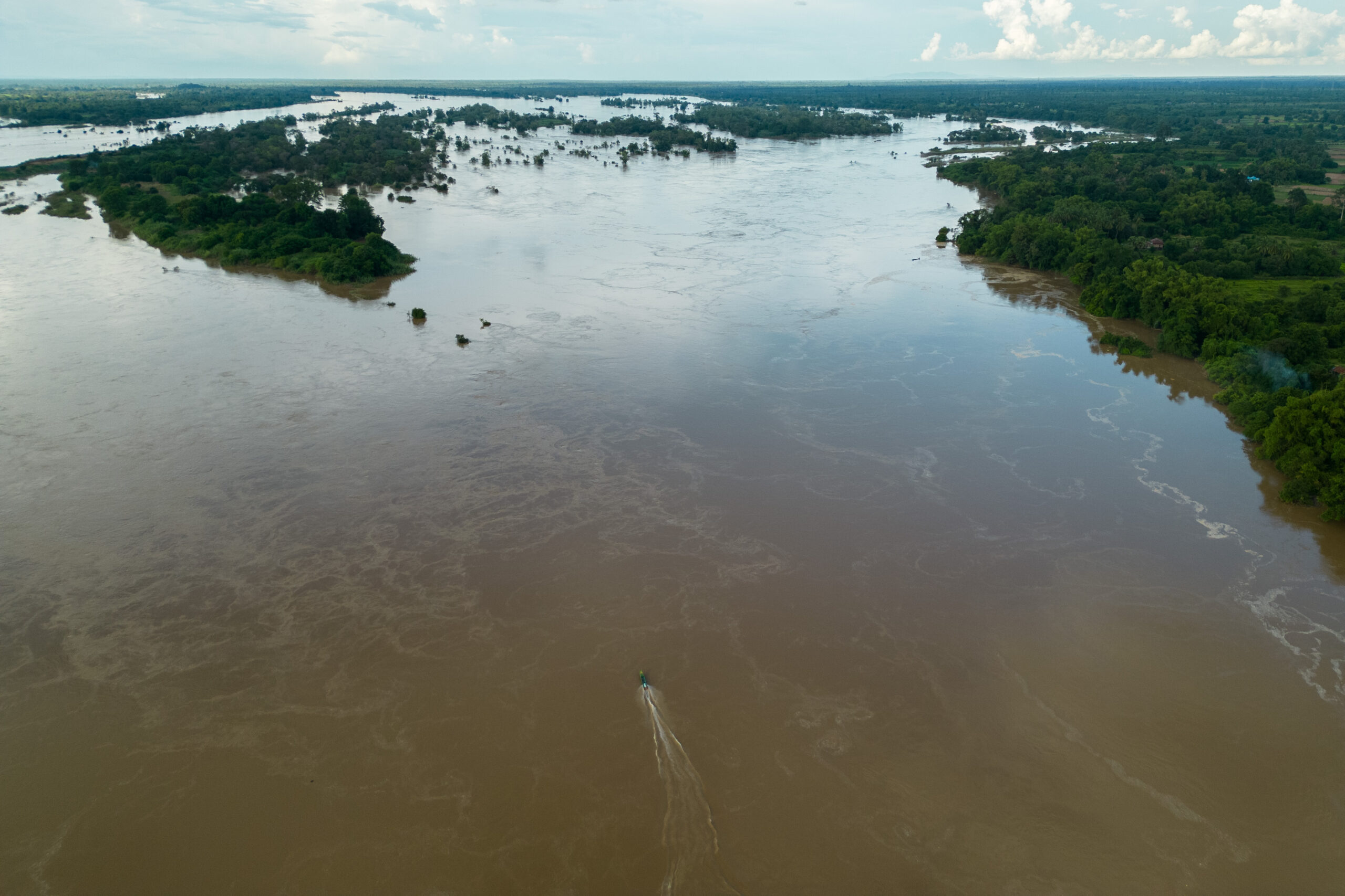 A lone boat heads up the Mekong River through the Stung Treng Ramsar site