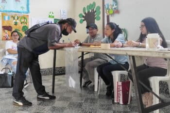 A resident of Asunción Mita confirms his identity and signature to vote in a school classroom during a municipal referendum on mining. Image by Sandra Cuffe.