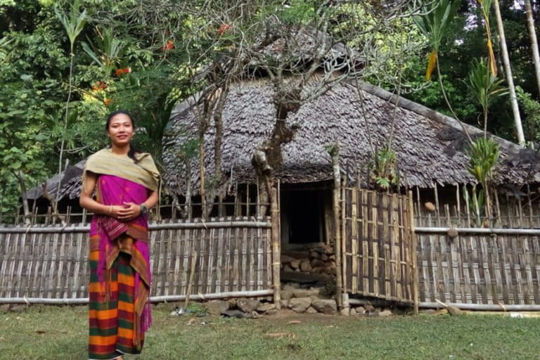 Mirnawati in front of the ancient Semokan Ruak mosque