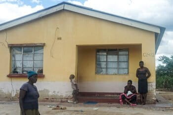 Alice Gama looks at cracks that have developed on the wall of her house in Arda Transau, an area near Zimbabwe’s Chiadzwa diamond fields. Image courtesy Linda Mujuru, GPJ Zimbabwe. Image courtesy of Evidence Chenjerai.