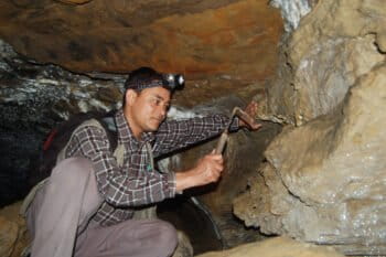 Budha looking for snails in a cave.