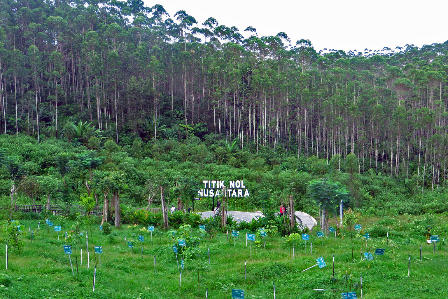 The Point Zero landmark with trees.