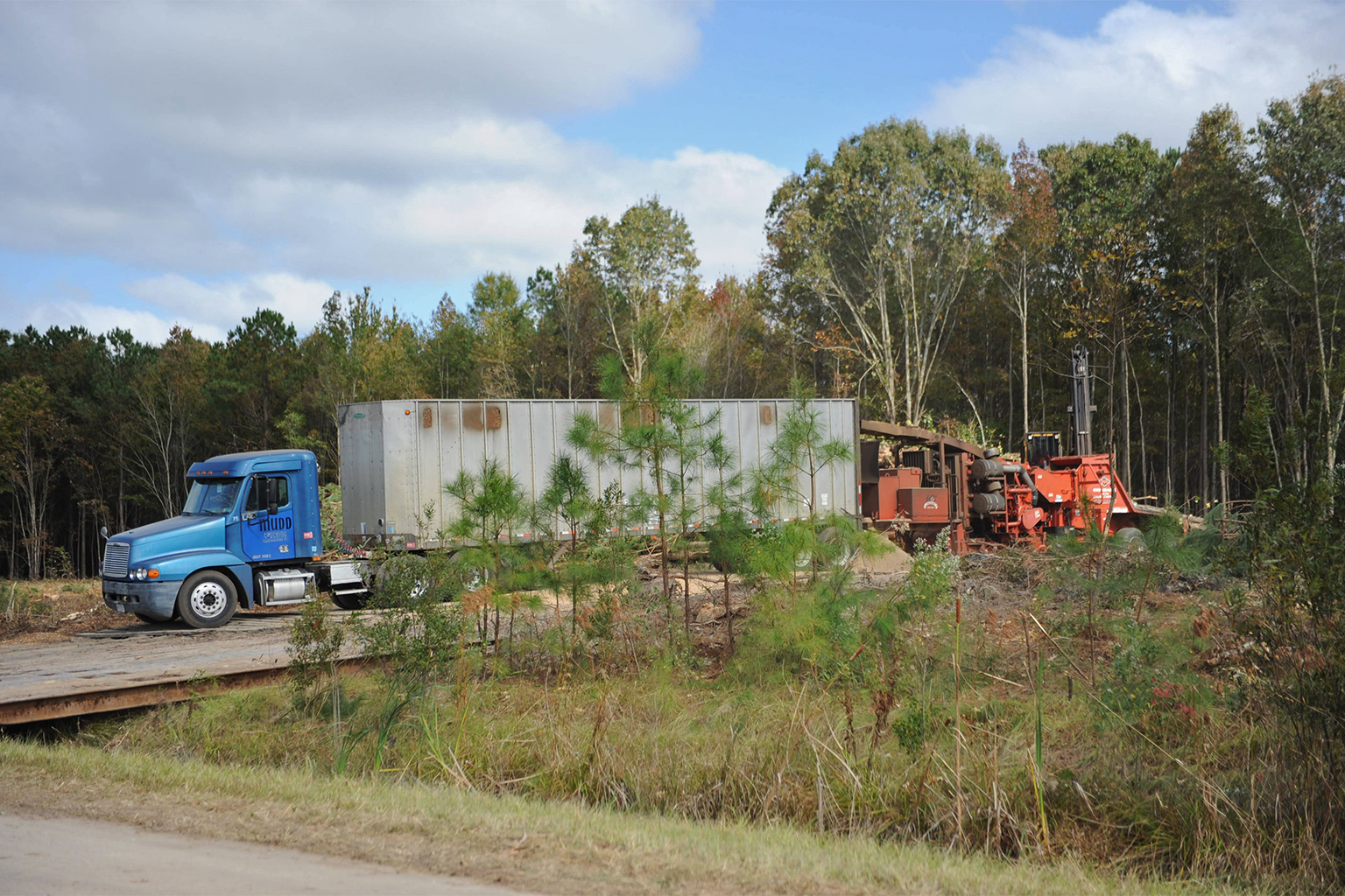 Trucks carrying 40 tons of wood chips.